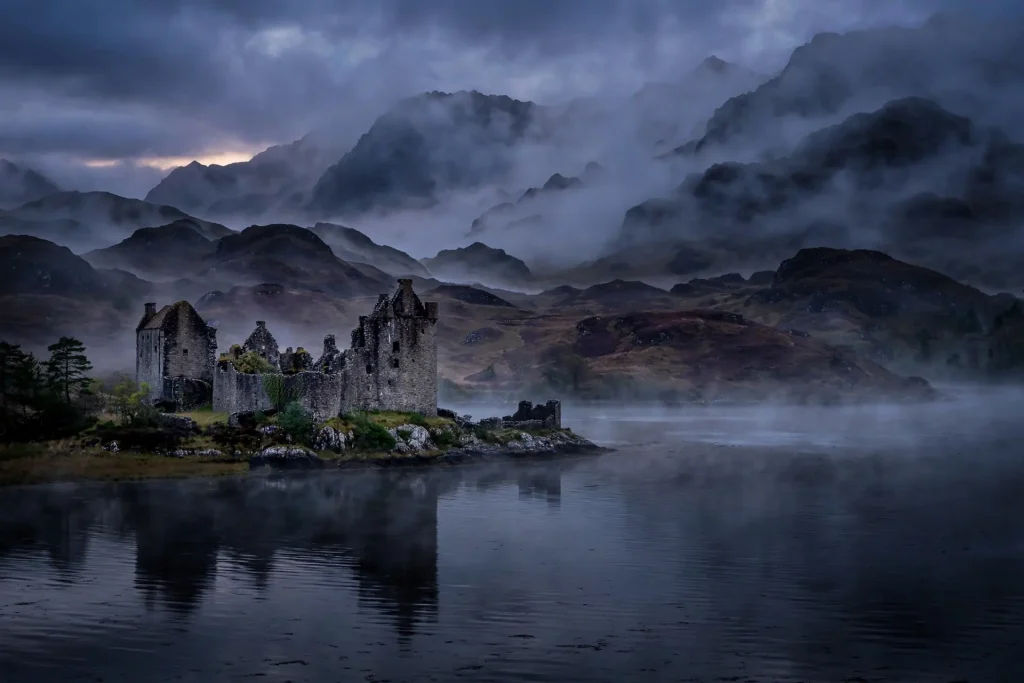 Scottish highlands loch with castle at dusk